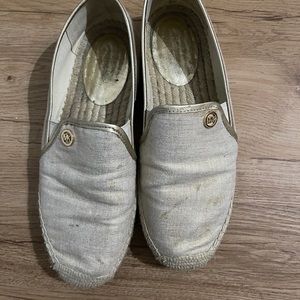 Michael Kors gold slip on loafers